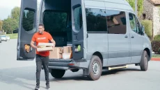 Delivery man unloading a delivery van