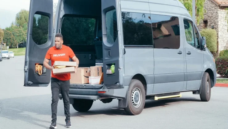 Delivery man unloading a delivery van